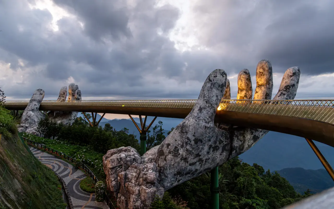 Golden Bridge held by giant stone hands in Ba Na Hills