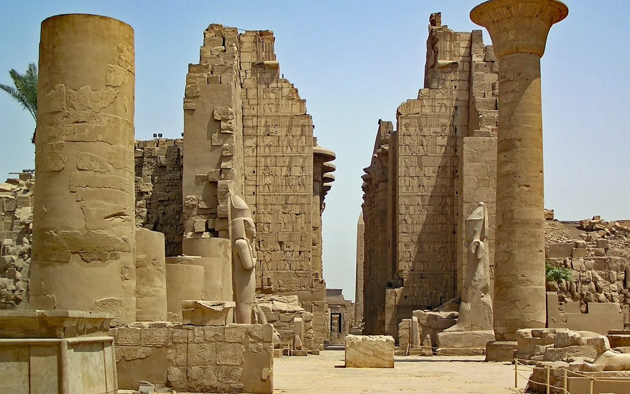 Ancient Egyptian Karnak temple complex with massive columns and hieroglyphics