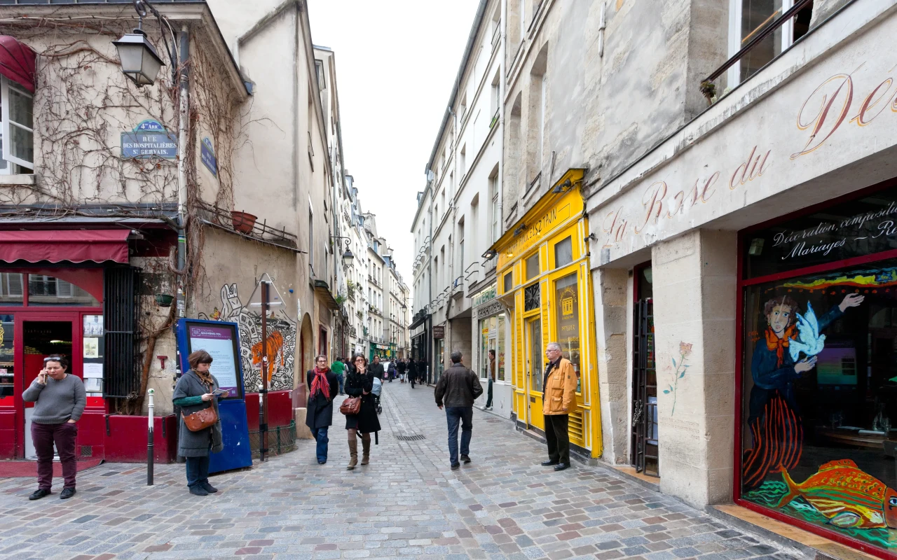 A picturesque view of the historic Le Marais district, with its charming narrow streets, trendy shops, and beautiful architecture in Paris, France.