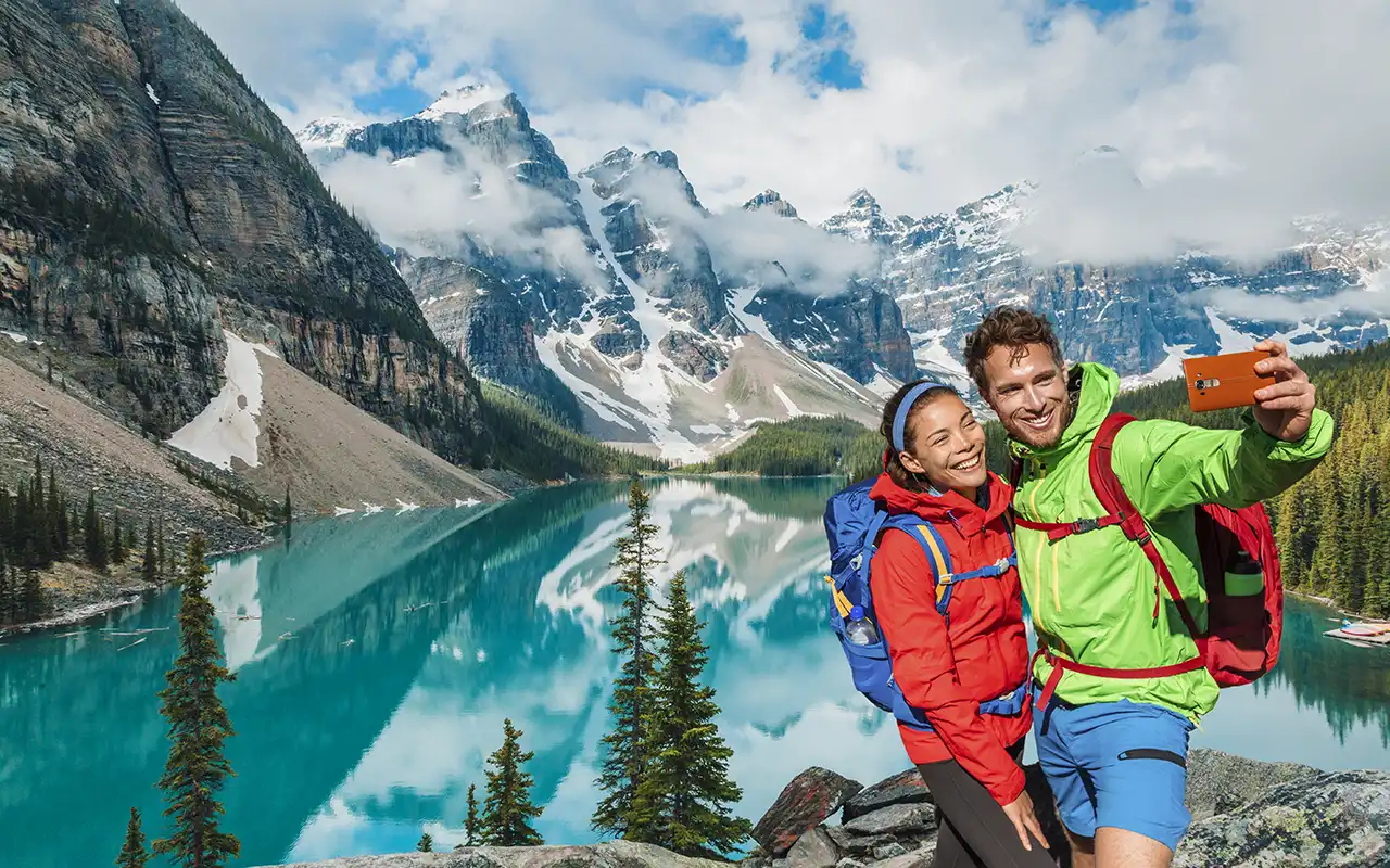 Couple enjoying a romantic boat ride on Lake Louise in Banff, Canada