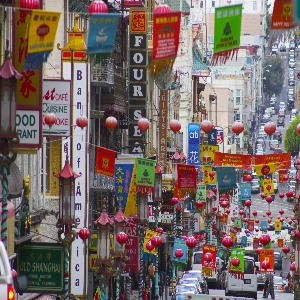 View of vibrant and colorful Chinatown in San Francisco, featuring traditional architecture and bustling streets