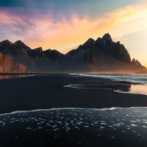 Breathtaking Mountain Landscape in Iceland Scenic view of mountains and beach in Iceland at sunset