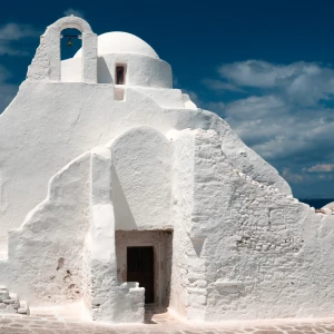 Image of the ancient Paraportiani 14th century church enveloped in clouds at Mykonos, Greece