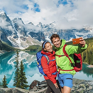 Couple enjoying a romantic boat ride on Lake Louise in Banff, Canada