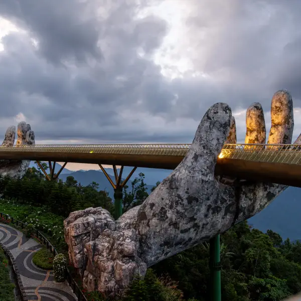 Golden Bridge held by giant stone hands in Ba Na Hills