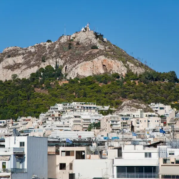 Mount Lycabettus in Athens, Greece - a hill offering panoramic views of Athens and the Aegean Sea, accessible by foot or cable car, and known for its stunning sunset vistas.