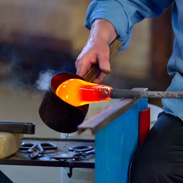 Artisan demonstrating the traditional Murano glass blowing technique in Italy